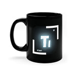 A black coffee mug with a white and blue logo on the side. The logo features the chemical symbol for titanium (Ti)