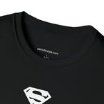 A close up of a black t-shirt collar with the website address "periodicstyle.com" printed inside the collar and the words "100% Cotton" printed below