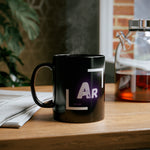 Front of a black coffee mug.Element symbol for Argon with atomic mass and atomic number.Cup is sitting on a desk.